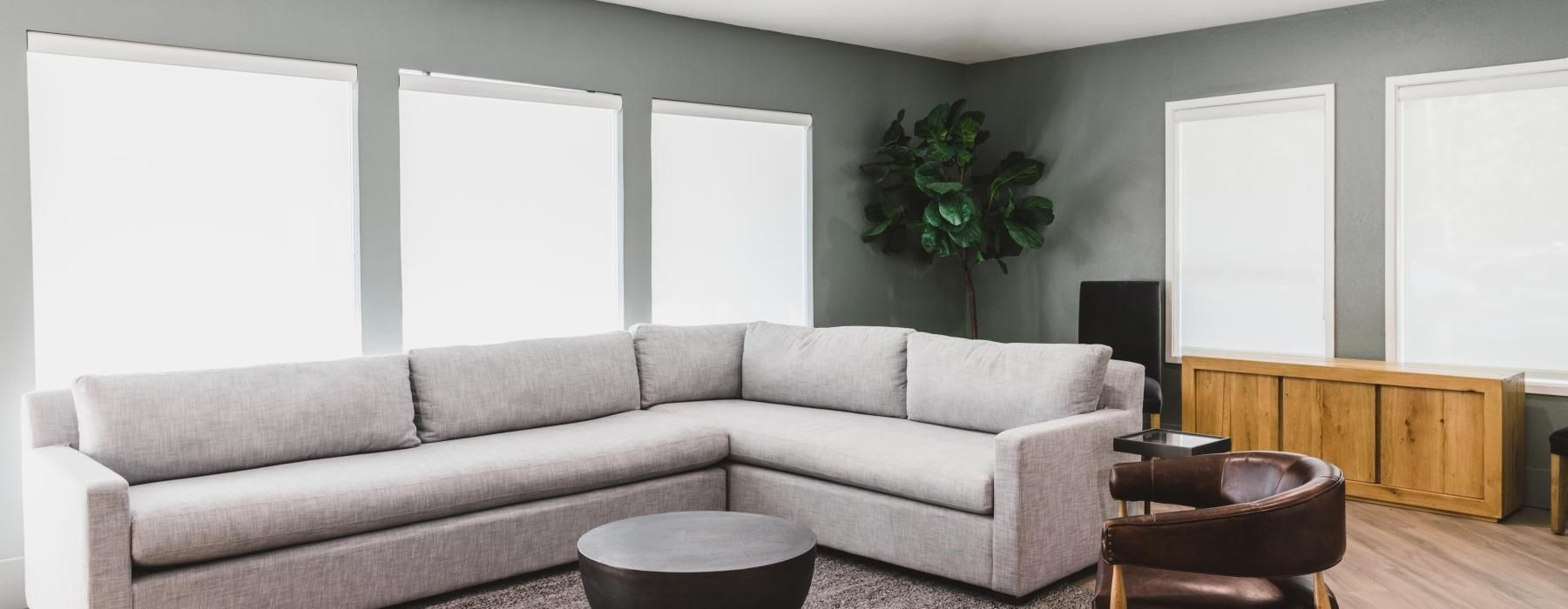a living room with a couch and chairs
