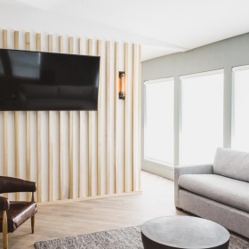 a living room with a tv and couches